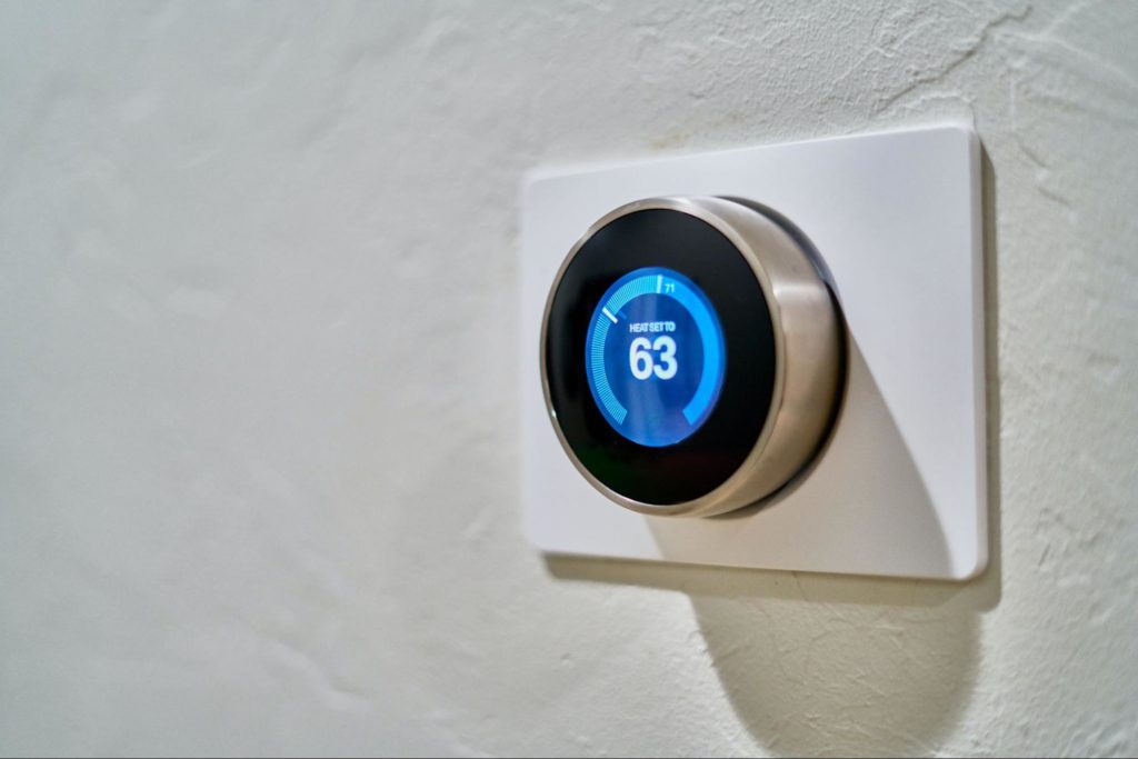 A wall-mounted smart thermostat